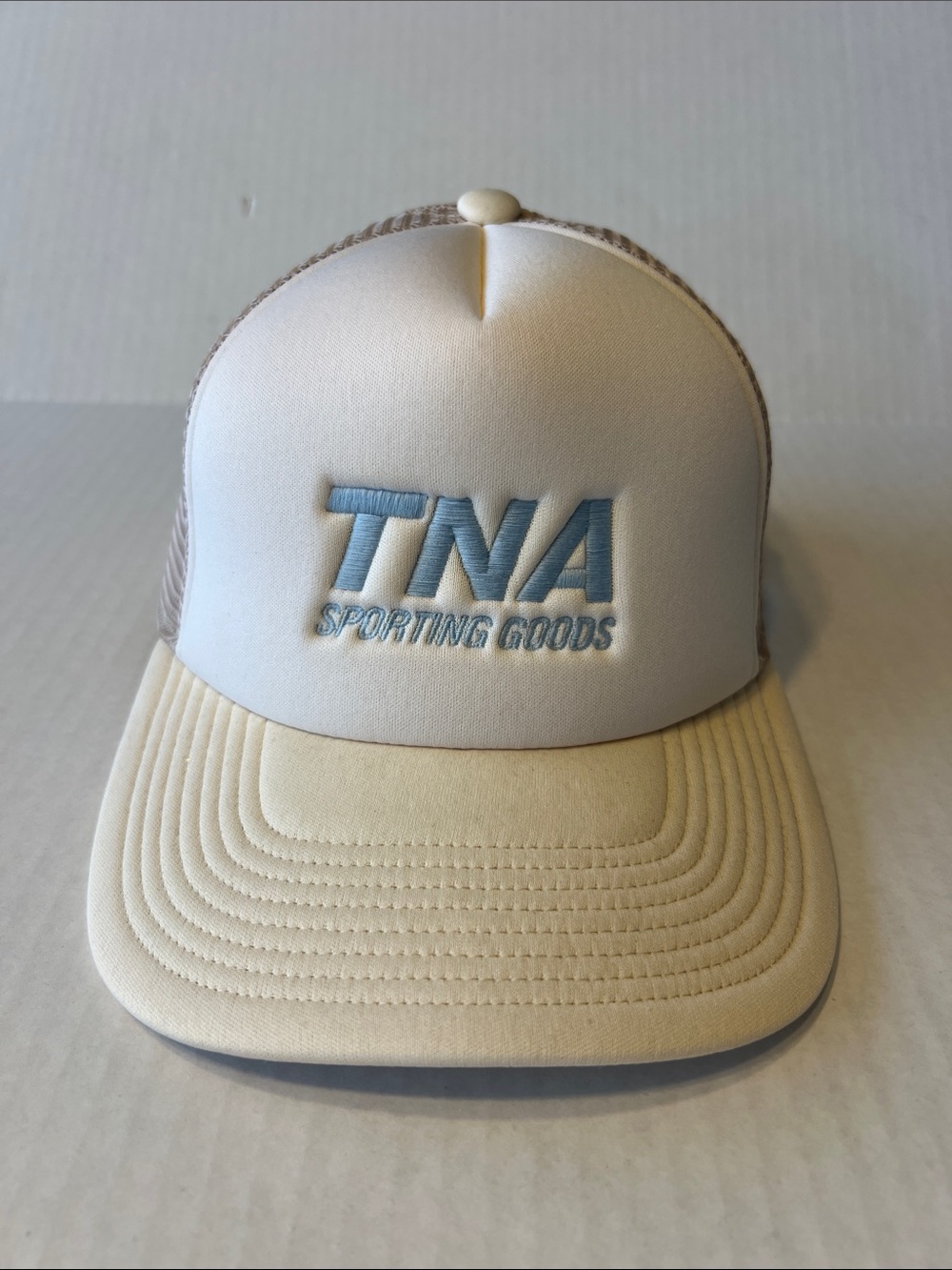 TNA Cream Trucker Hat with Light Blue Logo NWT